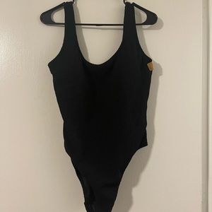 Pink Victoria’s Secret. One piece crinkle swim suit.